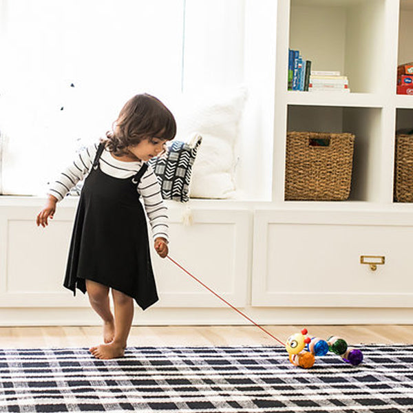  baby einstein young girls waling a toy