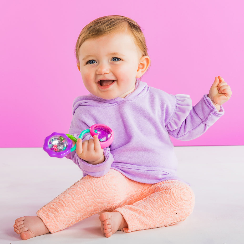 baby with rattle toy