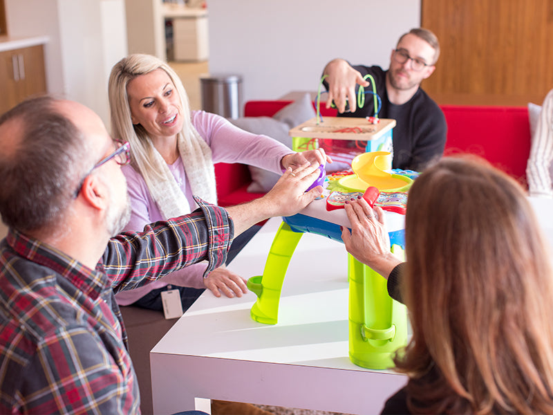 adults testing children toys