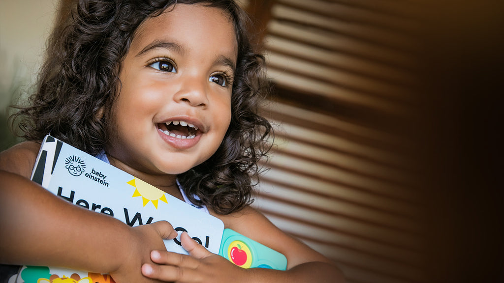 girl with book smiling